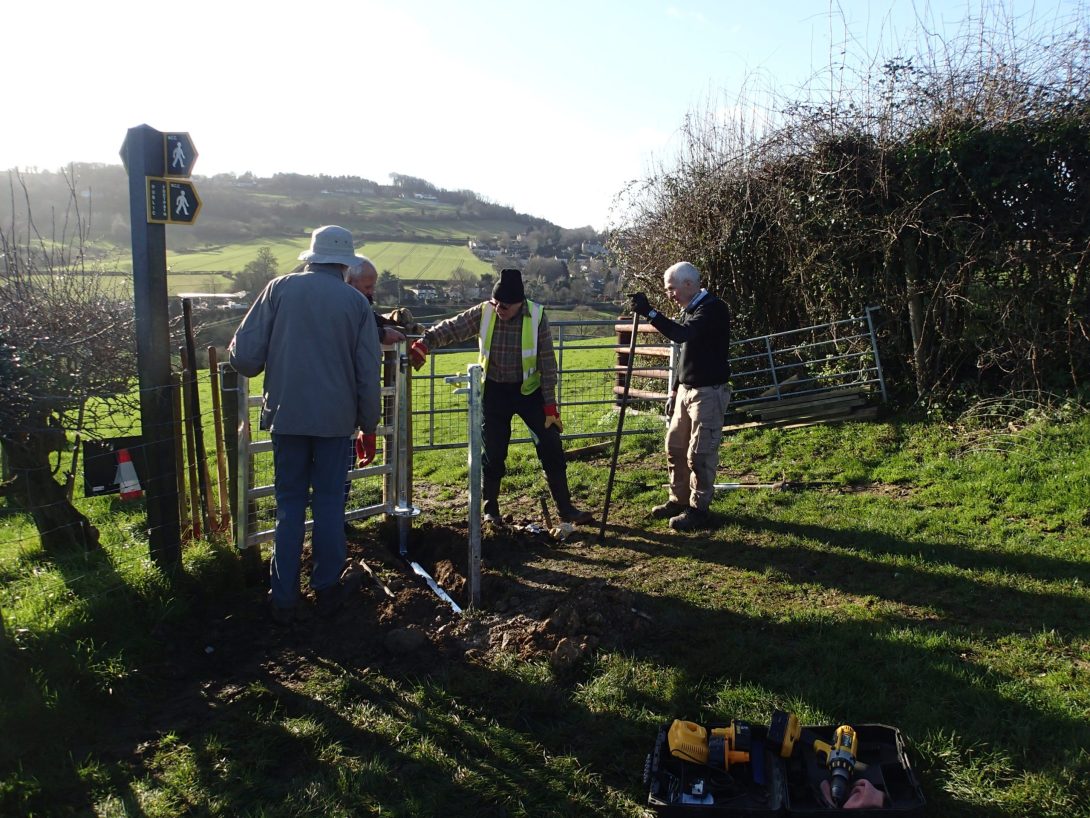 Photo of a group of volunteers installing a new gate