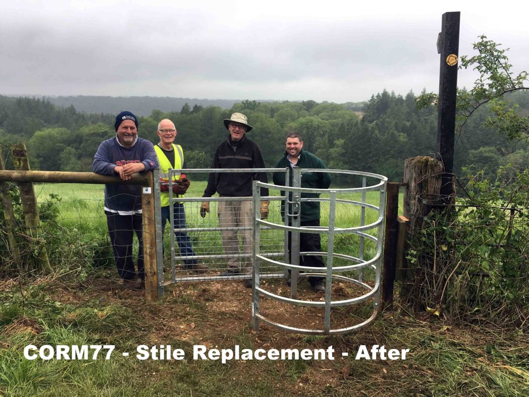 Wardens beside a newly installed gate